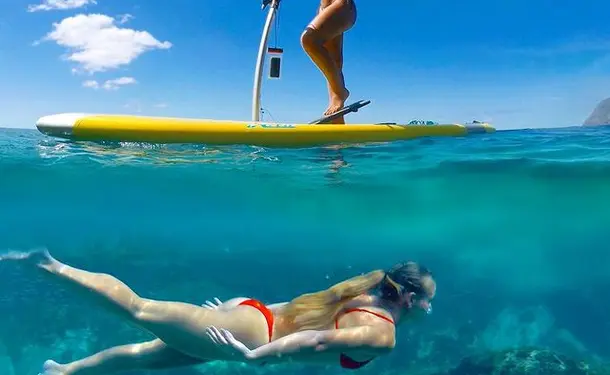 Step paddle on translucent water