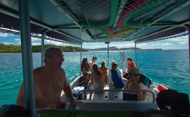 Webbed snorkeling by boat (on the corals)