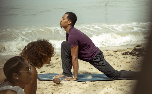 Hatha yoga on the beach