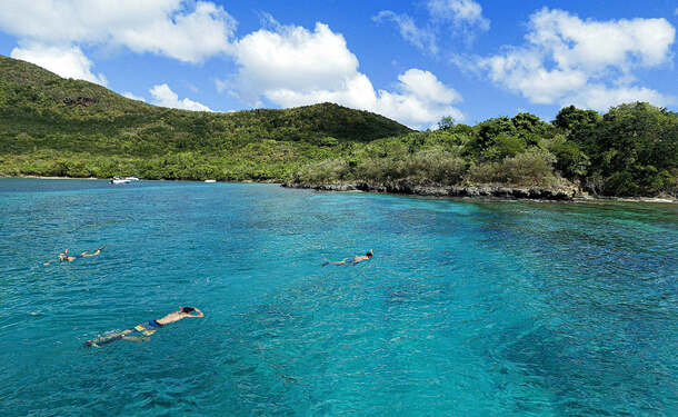 Snorkeling en bateau pour randonnée palmée (sur les coraux)