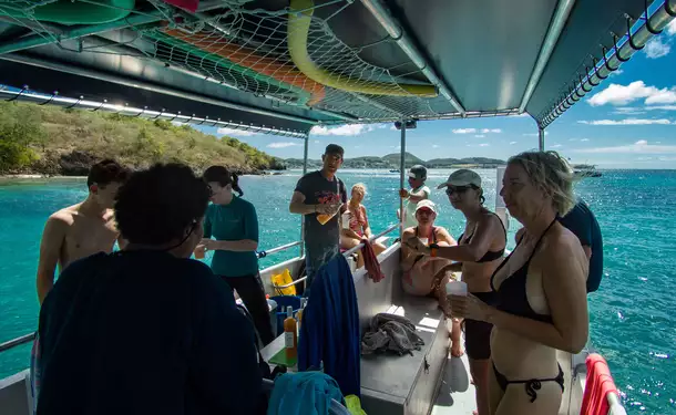 Webbed snorkeling by boat (on the corals)